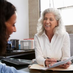Female manger interviewing a candidate for one of the practice's healthcare jobs | Vanguard Communications | Denver