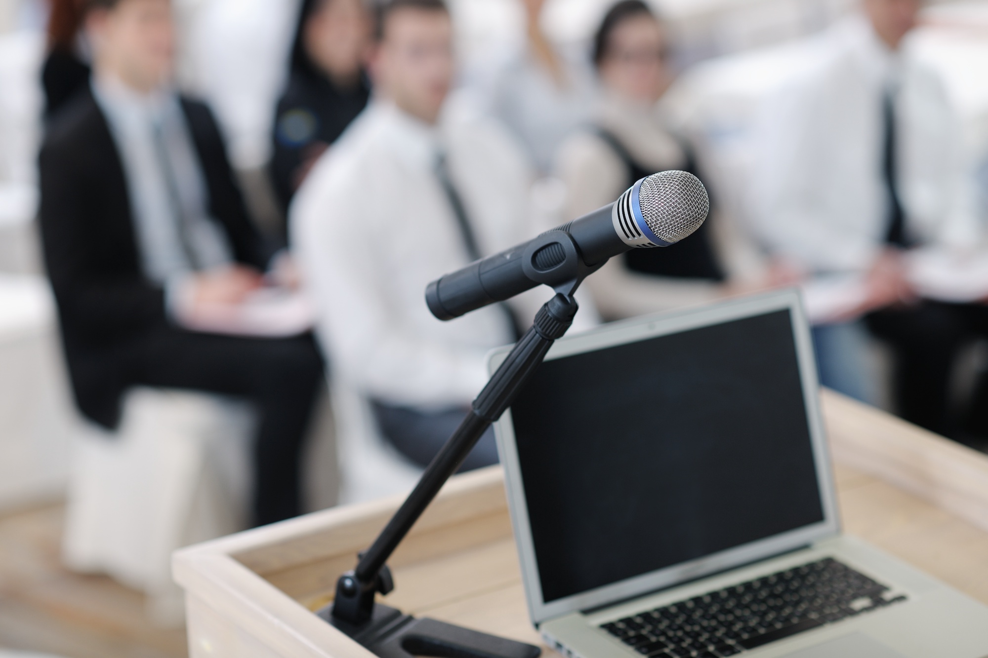 Healthcare Management & Marketing Talks & Conferences | Vanguard Communications | microphone near podium and laptop