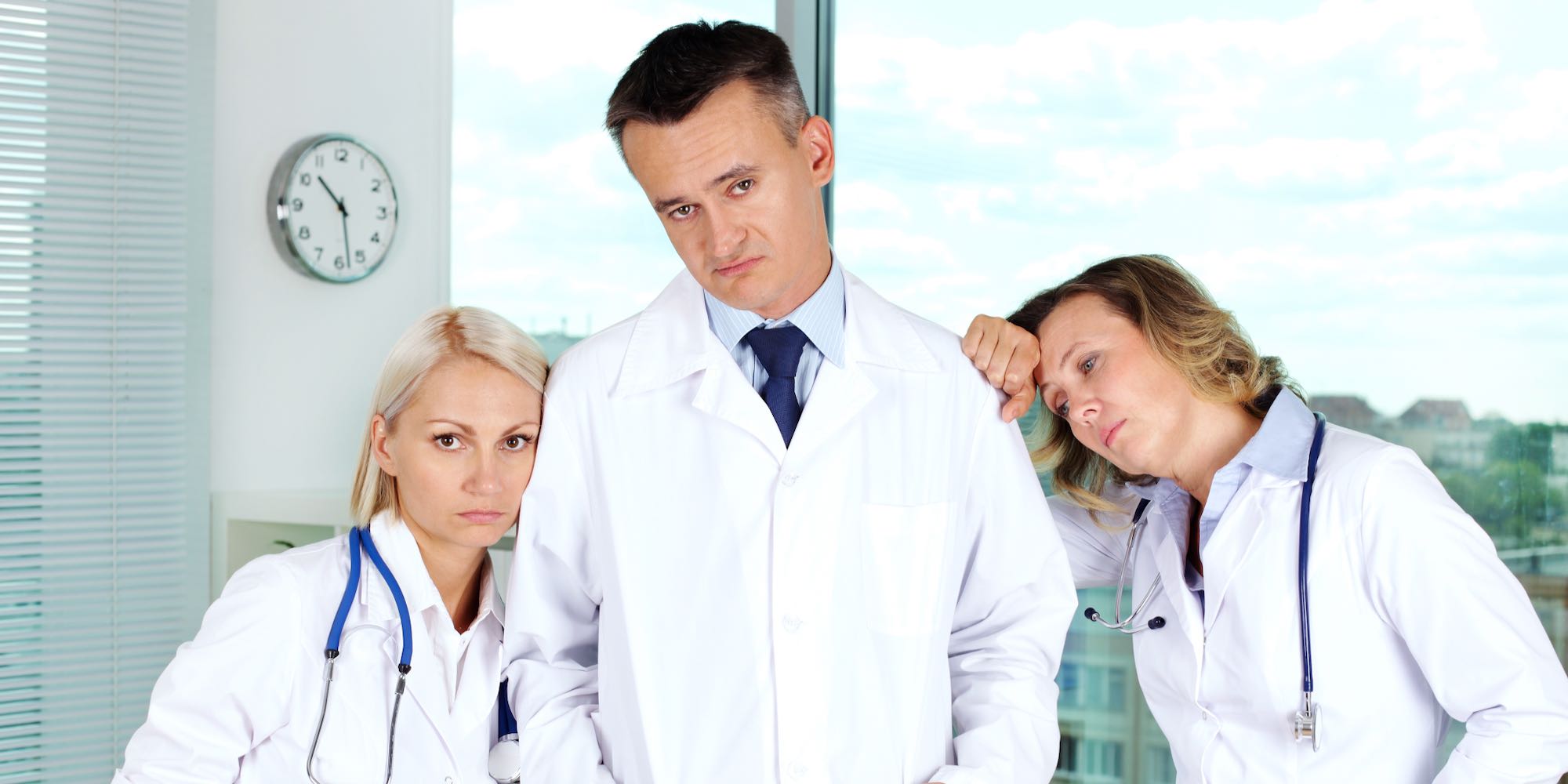 Three doctors in white coats unhappy about The Great Resignation | Vanguard Communications | Denver