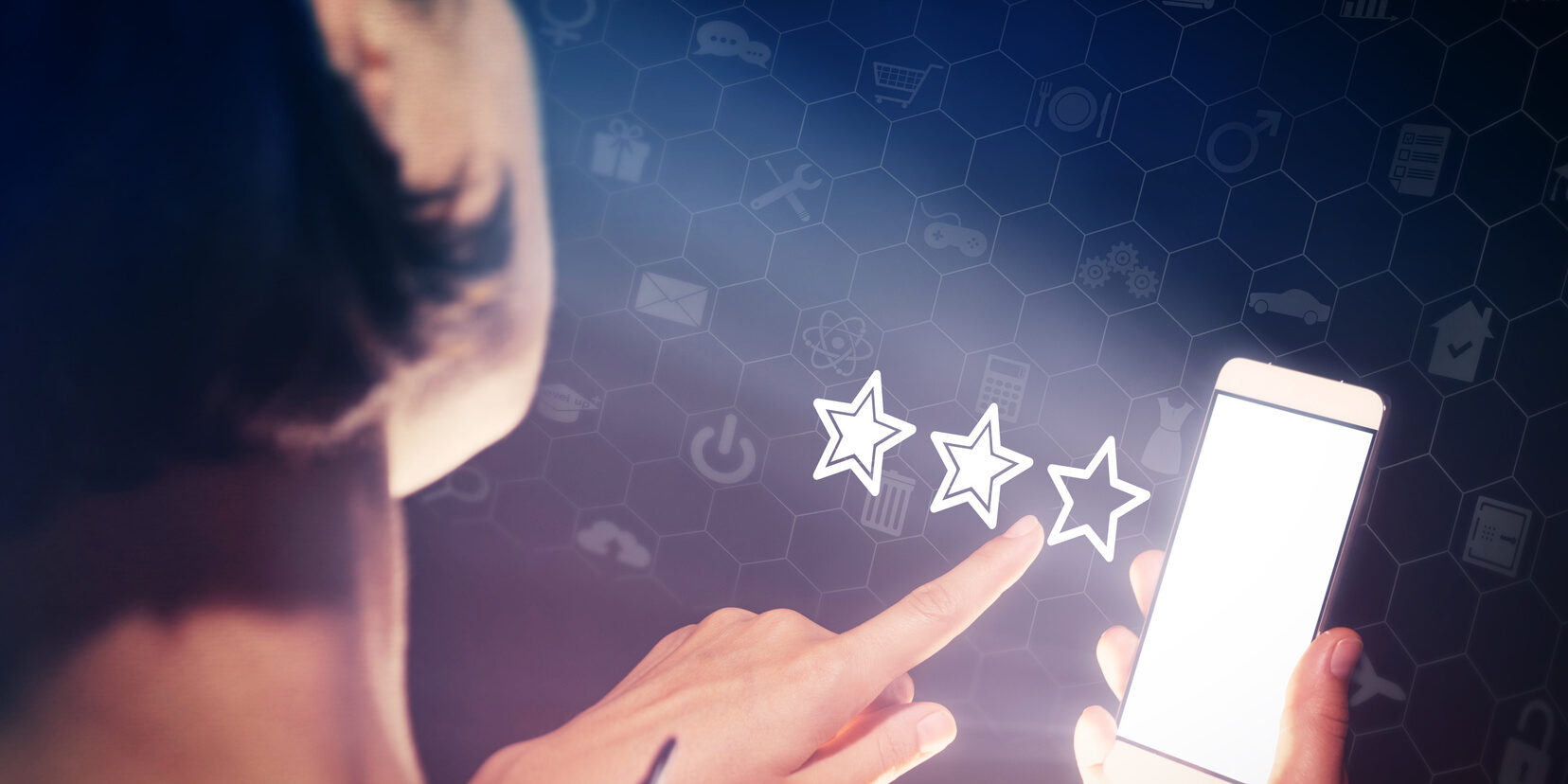 reviews online | Vanguard Communications | Denver | woman selecting a two-star rating on smartphone