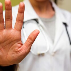 Doctor in white holding up a high five symbolizing the 5 Ps of marketing | Vanguard Communications