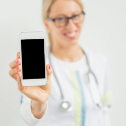 Patients record conversations with doctor | Vanguard Communications | Denver | doctor holding smartphone with a recorder