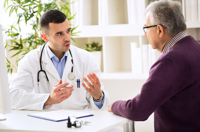 Doctor talking with male patient helps improve outcomes | Vanguard Communications | Denver, CO | San Jose, CA