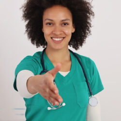 Nurse extending hand to greet patients is part of medical branding | Vanguard Communications | Denver, CO | San Jose, CA | Jacksonville, FL