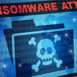Ransomware attack message with pirate symbol on a file folder | Blog on healthcare cybersecurity | Vanguard Comm. Denver