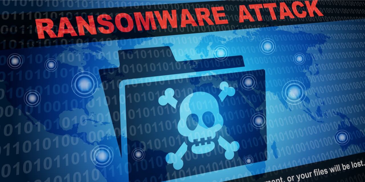 Ransomware attack message with pirate symbol on a file folder | Blog on healthcare cybersecurity | Vanguard Comm. Denver