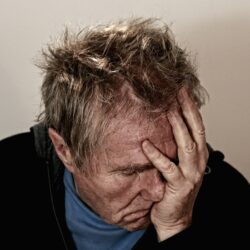 Distressed looking man in blog about how to manage doctor patient relations with an emotional upset patient | Vanguard Communications | Denver