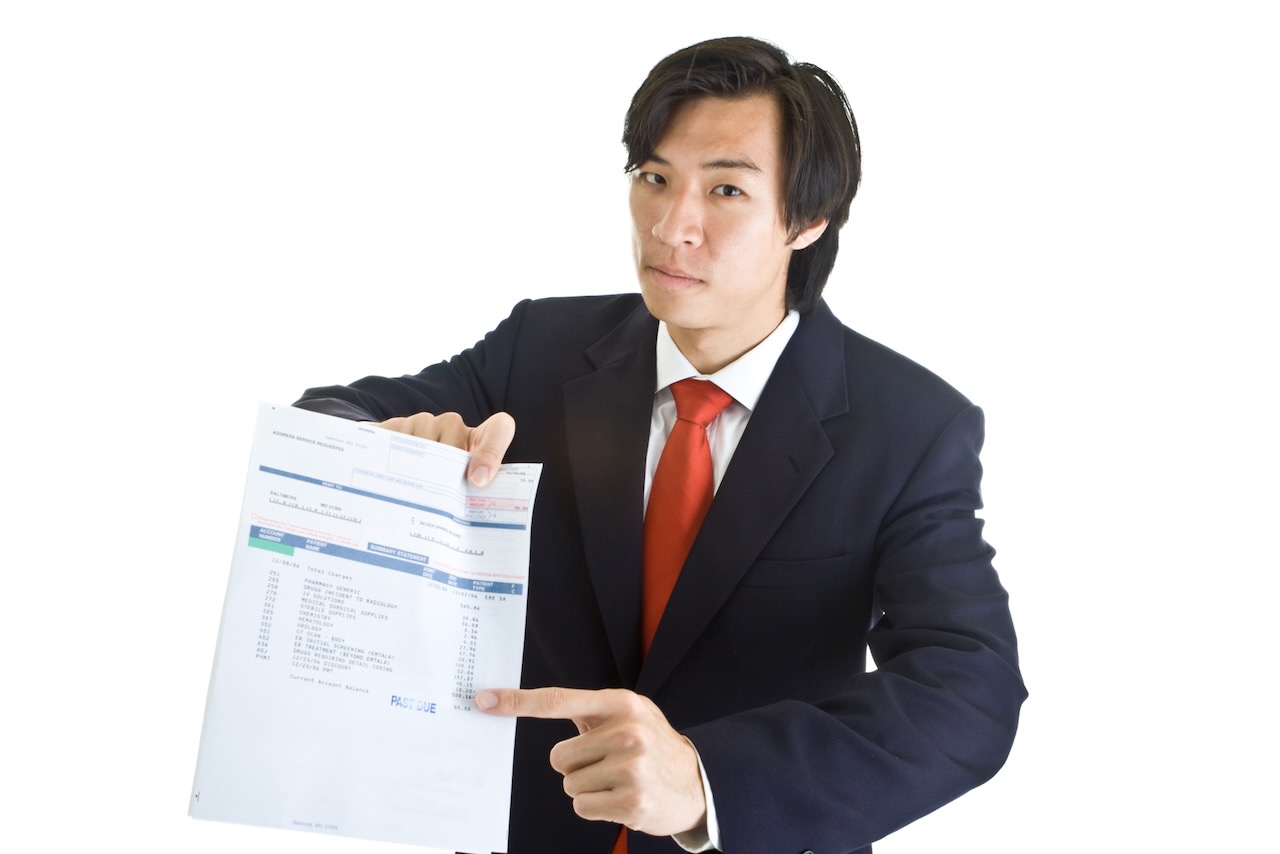 Male bill collector with medical debt bill | Vanguard Communications | Denver