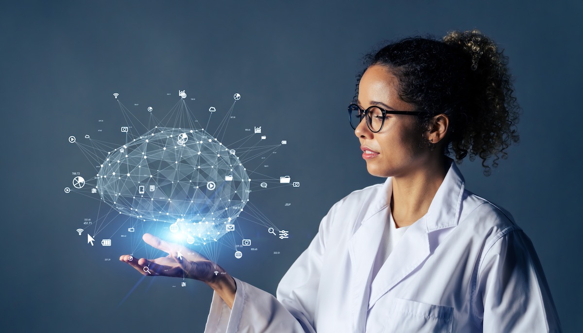 Black woman wearing lab coat with an AI-generated brain in her hand indicating ChatGPT use | Vanguard Communications | Denver, New Orleans, Jacksonville, FL