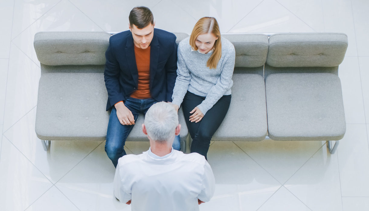 Couple in medical waiting room hoping for a good patient experience | Vanguard Communications | Denver, CO